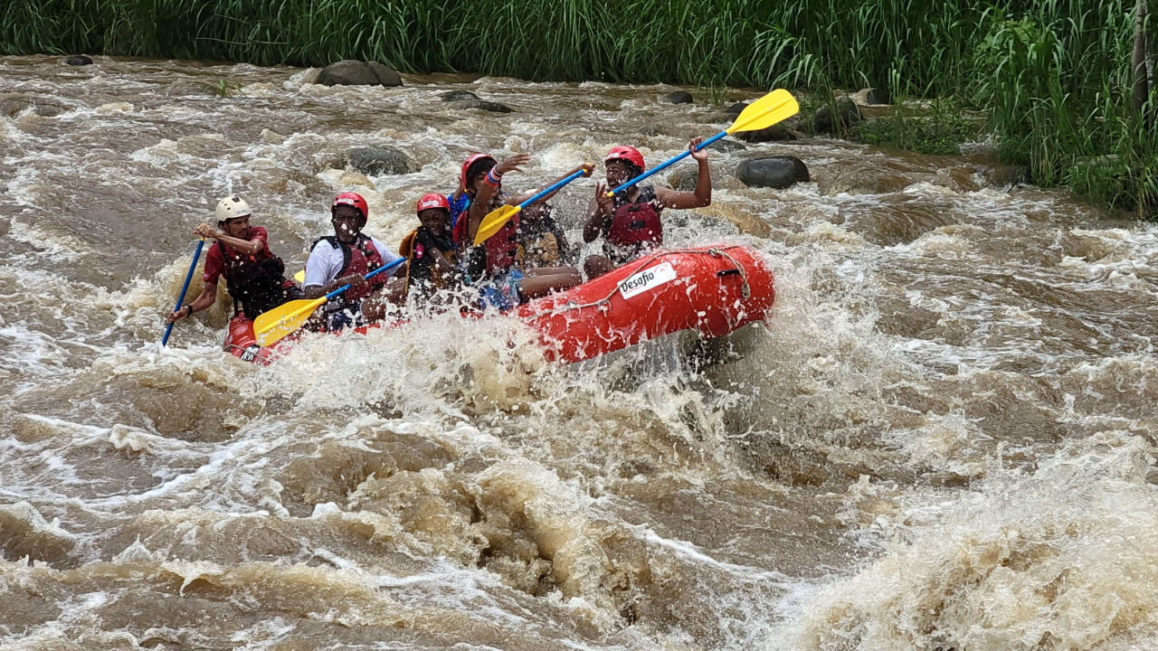 African American family white water rafting in La Fortuna, Costa Rica